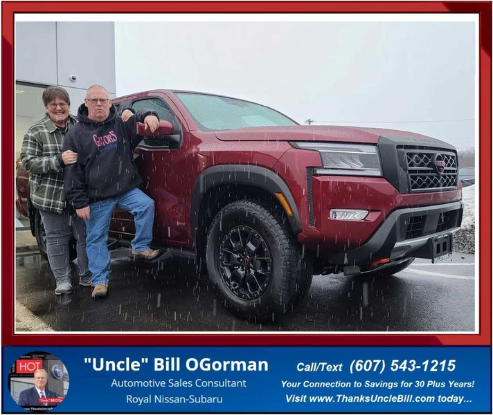 Mike Bentley posing with his wife Betty and his New Nissan Frontier Pro 4X from "Uncle" Bill